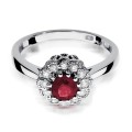 Złoty okazały pierścionek ozdobiony diamentami i rubinem 0,60 ct