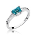 Złoty pierścionek ozdobiony diamentami i topazem 0.65 ct